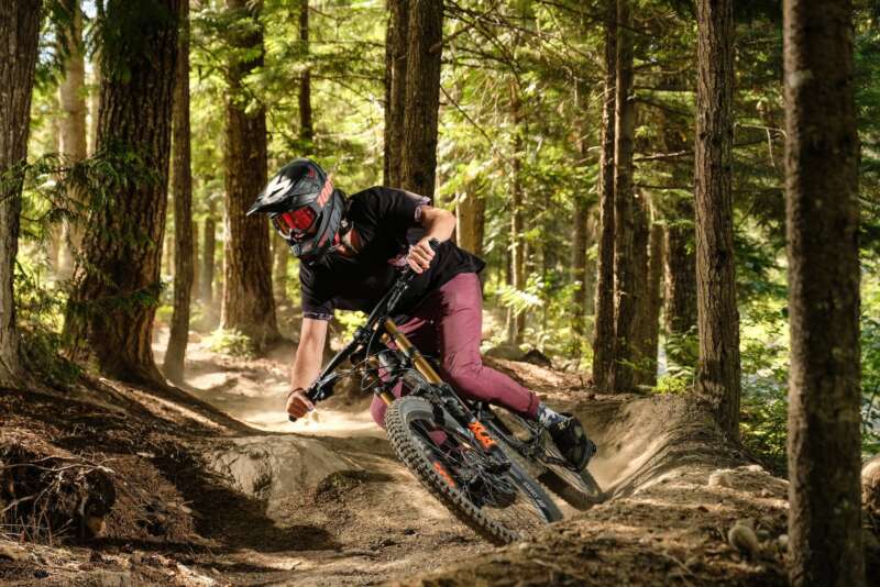 man mountain biking in forest